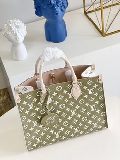 Description L.V Onthego MM Monogram Empreinte Khaki Green For Women, Tote Bags 35cm LV M46060 Rep 1:1 The OnTheGo tote bag is made from Monogram Empreinte, featuring the Monogram pattern on different coloured materials. The classic Monogram motif is first embossed, then printed. This is a roomy bag and can easily fit a laptop. Its two sets of handles, short and long, give carry options. 35 x 27 x 14 cm (Length x height x width) Khaki Green / Beige / Cream Microfiber lining Gold-color hardware In Onthego Mm, Louis Vuitton Onthego, Louis Vuitton Mm, Mm Monogram, Classic Monogram, Monogram Pattern, Green Beige, Colored Leather, Lady Dior Bag