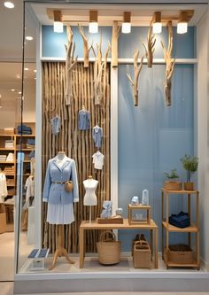 a clothing store display with deer antlers on the wall