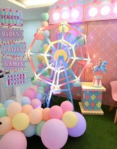 an amusement park themed party with balloons and decorations on the floor, including a ferris wheel