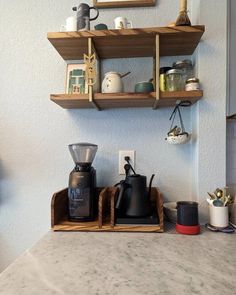 there are two shelves above the coffee maker