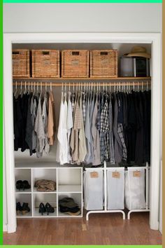 an organized closet with clothes and baskets