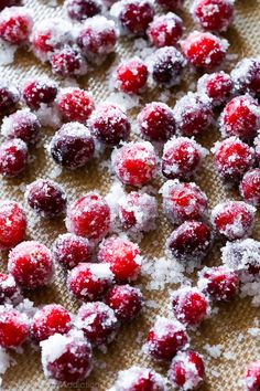 cranberries and powdered sugar are on a baking sheet, ready to be eaten