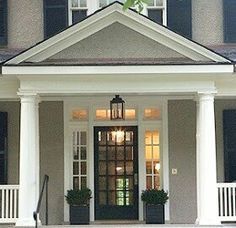 the front porch of a house with steps leading up to it