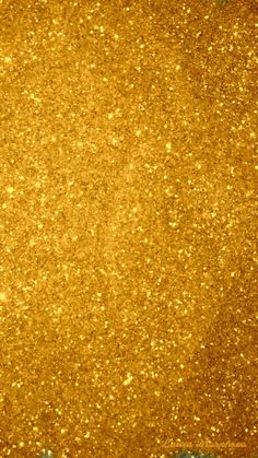 gold glitter sparkles in the air as it is golden