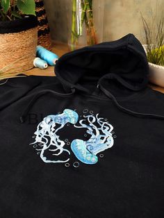 Hey, I'm happy to share my new project with you :)  Water Color Jellyfish Embroidered on Crewneck Sweatshirt, Hoodie Inspired by nature, organic elements and love.  Here's how to wash and take care of your next favorite sweatshirt/hoodie:  1. When to wash the sweatshirt ? I personally don't think that you need to wash it after every use. It needs to be washed after a few wears (five or six).  2. Which washing machine program should you use?  Turn the sweatshirt inside out and use the delicate or hand wash programs to respect the material. Unisex size for adults. Unisex size with variable sizes from XS to 3XL. Enjoy and contact me if you have any questions! Diy Clothes Design, Embroidery Hoodie, Embroidered Art, Art Sea, Outfit Inspo Casual, Blue Pullover, Embroidered Sweatshirt, Embroidered Sweatshirts, Art Clothes