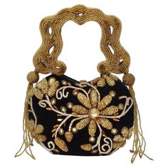 Your next favorite novelty clutch has arrived and it's calling your name! The most gorgeous minaudiere style evening clutch! Black velvet hard casing is accompanied by a plethora of gold beaded embellishments depicting beautiful flowers and abstract designs. Look closely and notice how intricate and detailed the beading is, this handbag is truly a miniature work of art. The star of the show has to be the beaded strap in this gorgeous structured squiggle design, once this catches your eye you sim Luxury Vintage Embellished Evening Bag, Manolo Heels, Vintage Embroidered Clutch Evening Bag, Vintage Black Embellished Bags, Luxury Vintage Beaded Shoulder Bag, Vintage Beaded Clutch Bag, Beaded Embellishments, Beaded Strap, Mary Frances