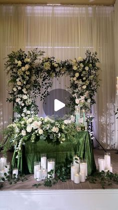 a table with candles and flowers on it