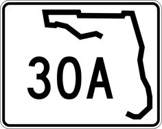 a white and black road sign with the number 30a