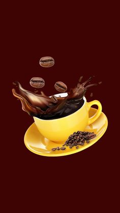 coffee is falling into a yellow cup and saucer with chocolate chips on the side