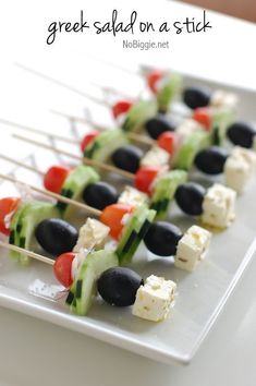 the skewers are filled with different types of vegetables and cheeses on them