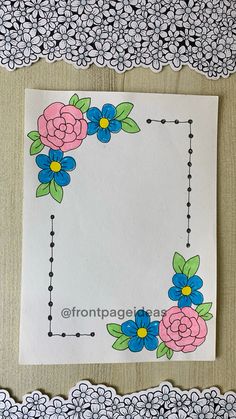 a piece of paper with flowers on it next to doily and lace trimming