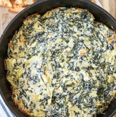 spinach and cheese casserole in a skillet