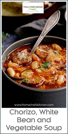 a pan filled with shrimp, white bean and vegetable soup on top of a table