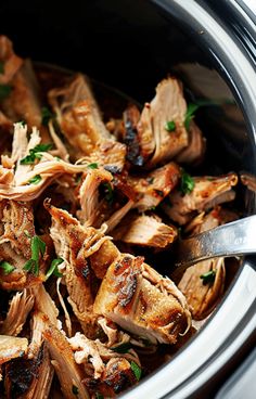 the meat is being cooked in the slow cooker