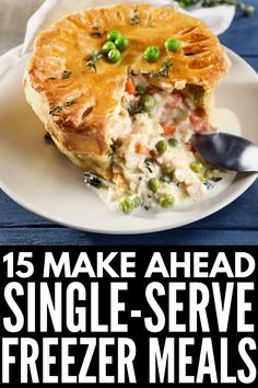 a white plate topped with a pie covered in vegetables and peas next to a fork