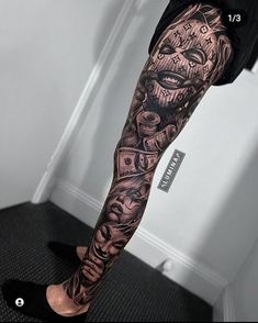 a man's leg with some tattoos on it