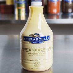 a bottle of white chocolate sitting on top of a counter