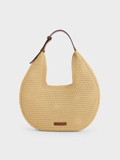 This product is made with at least 20% sustainable materials by weight. CHARLES & KEITH uses recycled, degradable, organic, and water-based materials in our eco-conscious collection. With a sleek curved silhouette and a capacious interior that will hold everything you need and more, this Ida hobo bag comes with a detachable pouch that will help keep your essentials neat and organised. Plus points for the wide angular opening -- secured by a magnetic closure -- that allows this piece to hang comfortably on your shoulder, but also offers easy access to your belongings. Neutral Bags, Wallet Gifts, Charles Keith, Eco Conscious, Sustainable Materials, Kids Gifts, Bag Straps, Stripes Design, Hobo Bag