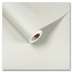 a roll of white paper sitting on top of a table