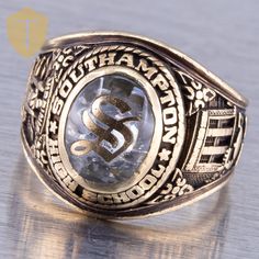 This stunning men's 10K yellow gold 1973 class ring from South Hampton High School features a beautiful smooth oval cut clear stone at its center. This ring has a band thickness of approximately 1.1mm, approximate band width of 5.1mm, finger coverage of approximately 16.4mm and a rise of 5.4mm.  Karat / Weight: 10KYG / 9.3G Size: US 6.5 Stone: Clear Stone Markings: Balfour 10k with initials R.M.S Condition: Great Era: 1973 DELIVERY Our shipping and handling is always fast & free unless otherwise stated. Once an order is placed and payment is received, all items are shipped within one business day, excluding weekends.   For international shipments, we use Etsy's International Shipping Program. RETURNS We are flexible and will always do everything we can to make sure our customers are happy! Men Class Ring, Mens Gold Rings Vintage Antique Jewelry, Class Rings High School Vintage, College Class Ring, High School Class Rings, High School Rings, School Rings, South Hampton, Vintage 1973