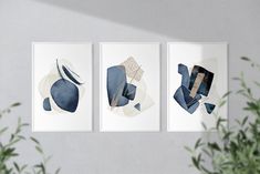 three abstract paintings hang on the wall next to a potted plant