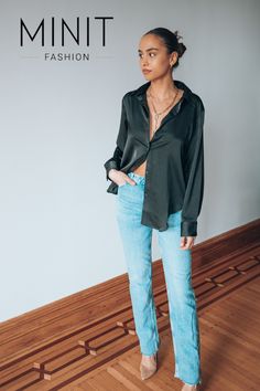 This black silk button-up blouse is the perfect piece to add to your travel wardrobe. It's made from a wrinkle-resistant fabric that will look great even after a long day of travel, and it has a versatile silhouette that can be dressed up or down. Whether you're flying across the country or driving across town, this blouse will make you look and feel your best.