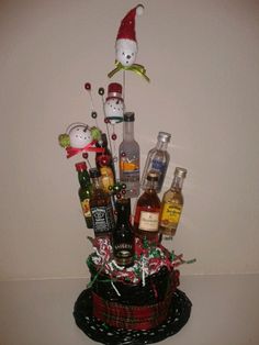 a basket filled with liquor bottles on top of a table