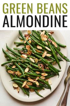 green beans with almonds on a white plate