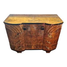 an old wooden chest with two drawers on one side and three doors on the other