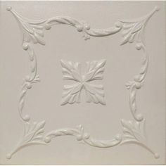 a white ceiling tile with an ornate design on the center and bottom part of it