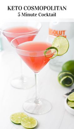 two glasses filled with pink cocktail and limes