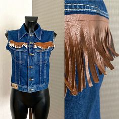 "Women's Vest Denim Vest Blue Denim Crop Vest Women Cropped Waistcoat Metal Buttons Country Western Cowboy Boho Fringed Denim Jacket Size S/M ♥ Women's Vest ♥ Brown fringes around ♥ Sleeveless ♥ 2 Front Pockets ♥ 6 Button up Closure Condition: Vintage Fair: Very Good condition Tag: Lois, Made in Spain-Valencia Materials: 100% Cotton Size: 42 ( Fit on S/M) See Masurements.. Measurements: Length : 49cm = 19,2\" Bust : 88cm = 34,6'' Waist : 76cm = 30'' **Measurements are taken with the garment lying flat. (Some sizes then doubled - Bust, Waist, Hips). Be sure to leave room for movement and comfort** Additional Notes: Please note that due to the nature of vintage clothing, ALL ITEMS ARE SOLD AS-IS; with no returns or exchanges, regardless of fit or condition. We try our best to give as much me Denim Jacket With Pockets For Rodeo, Western Style Denim Blue Jacket For Fall, Blue Denim Vest For Fall, Dark Wash Denim Jacket With Pockets For Rodeo, Medium Wash Denim Outerwear For Rodeo, Retro Blue Denim Vest For Fall, Fall Rodeo Denim Jacket, Western Blue Denim Jacket For Fall, Western Denim Vest For Fall