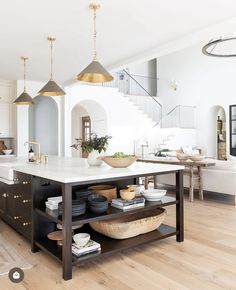 a kitchen island with plates and bowls on it