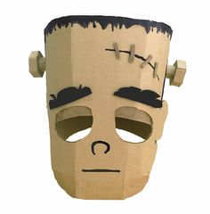 a paper mache mask with black hair and eyebrows on it's face is shown in front of a white background