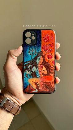 someone is holding up their phone case with an image of two women in the background