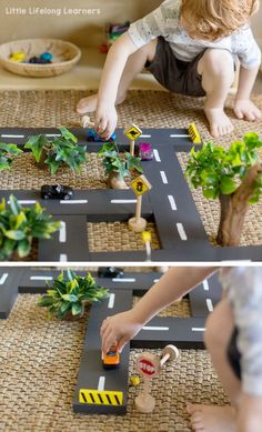 a toddler playing with toys on the floor and in front of him is a toy road