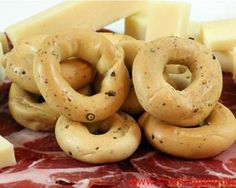 several different types of meat and cheese on a plate