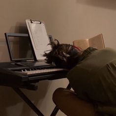 a person laying their head on a keyboard