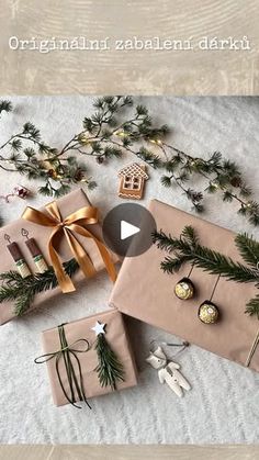 christmas presents wrapped in brown paper and tied with gold ribbon on top of snow covered ground