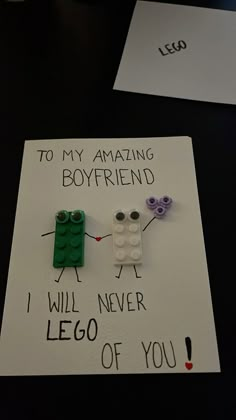 two legos sitting on top of a piece of paper that says to my amazing boyfriend i will never lego of you