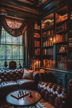 a living room filled with lots of books and furniture