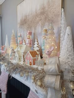 a mantel covered in christmas decorations and lights next to a painting on the wall