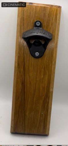 a wooden object with a metal handle on it