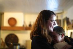 two women hug each other in the kitchen