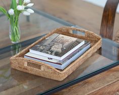 a wicker basket sitting on top of a glass table