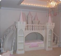 a pink princess castle bed in the corner of a room