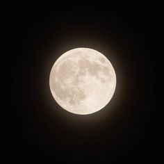 the full moon is seen in the dark sky