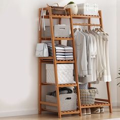 a wooden shelf filled with clothes and baskets