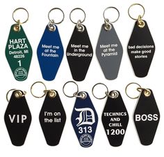 six key chains with different colored tags attached to them, each one has an individual's name on it