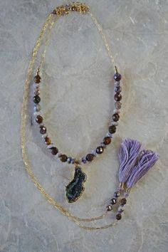 A boho wrap necklace stunner with a sparkly occo agate geode and lots of crystals in the center. The gemstones in the wrap necklace are natural faceted Peitersite in rich tones of brown, copper and caramel paired with Lepidolite in cool shades of dusty lavender. The lavender Lepidolite brings out the the subtle purple undertones in the Peitersite creating a unique statement for your boho chic look. This wrap necklace is a faux wrap, meaning it does have a clasp in the back to keep the necklace i Bohemian Hand Knotted Agate Jewelry, Bohemian Hand-knotted Agate Jewelry, Handmade Bohemian Agate Geodes, Bohemian Agate Geodes, Bohemian Geodes For Healing With Natural Stones, Bohemian Natural Stone Geodes For Healing, Bohemian Geodes For Healing, Bohemian Agate Necklace With Gemstone Accents, Geode Necklace